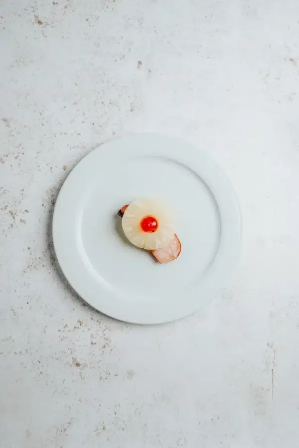 Lomo adobado de cerdo con piña · Churrasquería Rodeo Grill